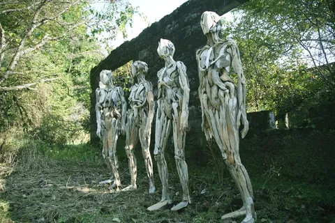 Eerie humanoid sculptures made out of driftwood by Japanese artist Nagato Iwasaki.