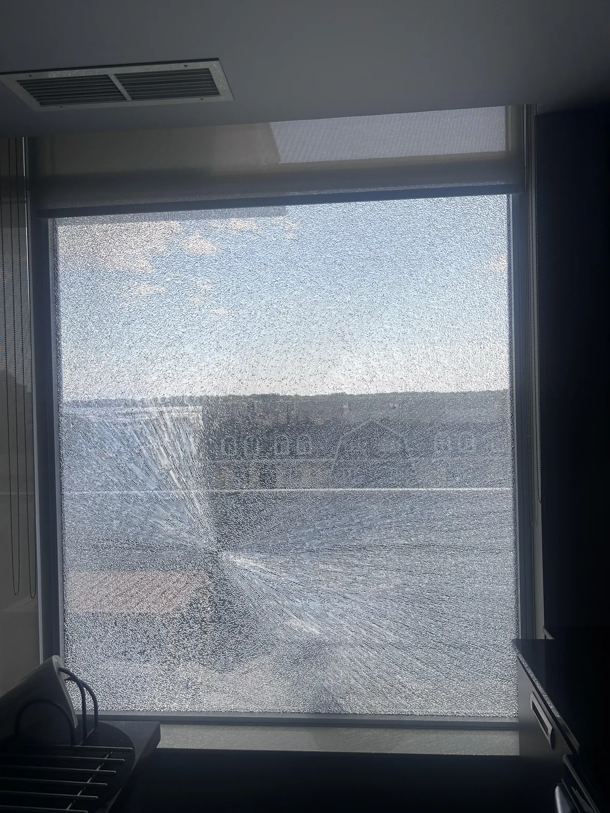Huge glass window spontaneously shattered