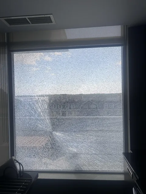 Huge glass window spontaneously shattered
