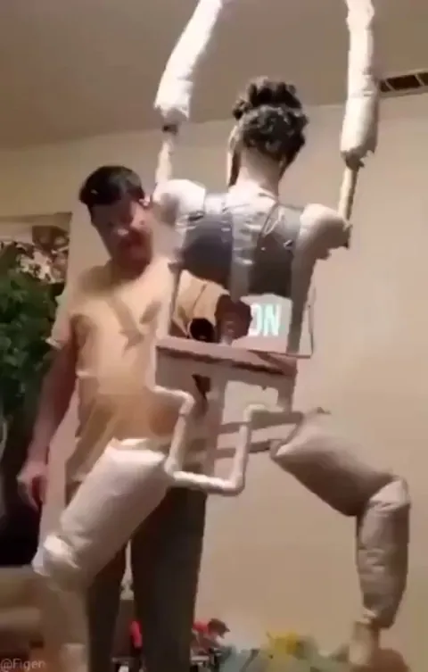 Guy builds realistic human animatronic and hangs it off the edge of his roof - firetruck shows up