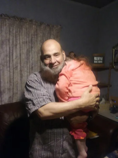 A photo of Mohamed Bzeek who since 1995 has fostered only terminally ill children. Source for the information located the comments section