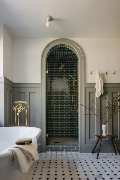 Tiled shower with an arched entrance in a renovated bathroom, Geneva near Chicago, Kane County, Illinois [2048x3072]