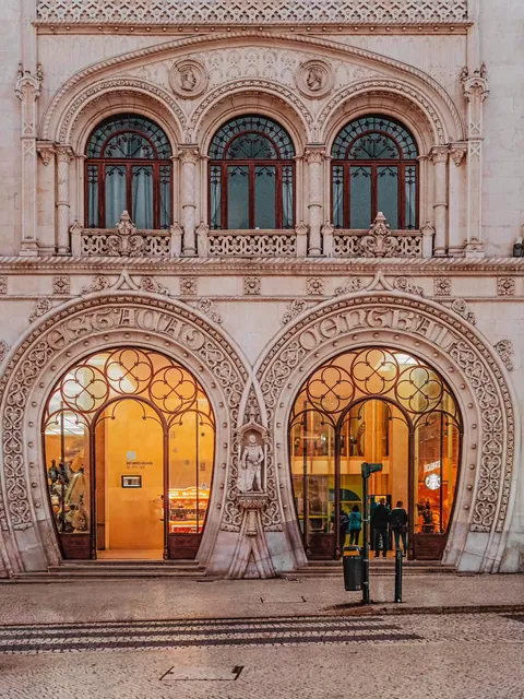 Neo-Manueline façade of the late 19th-century Rossio Railway Station featuring two intertwined horseshoe portals, Lisbon, Portugal.