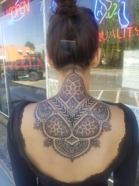 Upper back over neck piece by Mark Stewart at Triumph Tattoo, Burlington WA