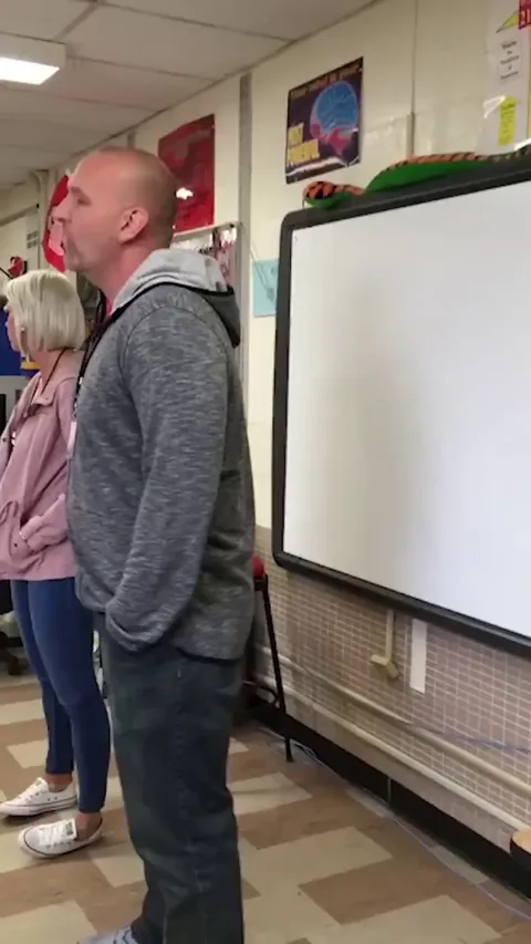 Teacher proposes to another teacher in front of her class!