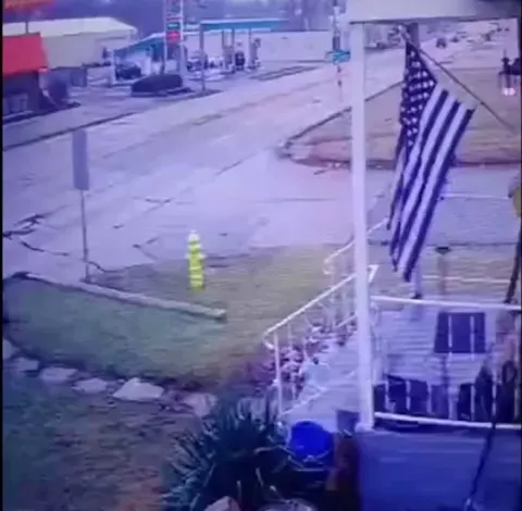 A young man saves a neighborhood kid from walking into traffic