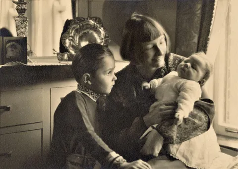 1925: My grandmother, Julia, holds her newborn son, Robert, while her older son, Paul, looks on. My uncles Rob and Paul later served in WW2 and both came back safe. They all lived long lives and were wonderful family.