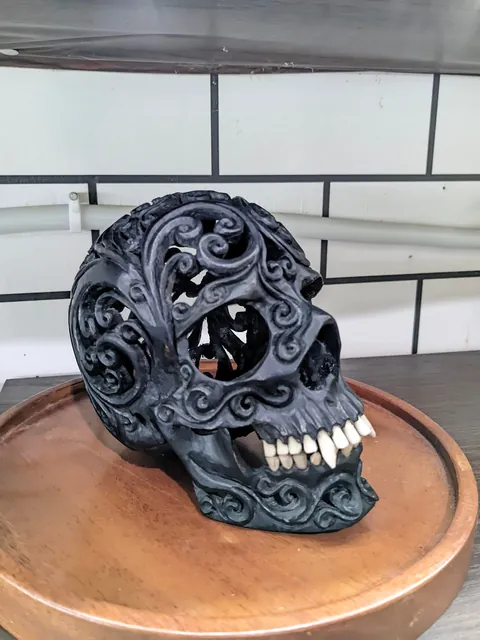 I made a skull carving from ebony wood, the teeth are made from cow bone