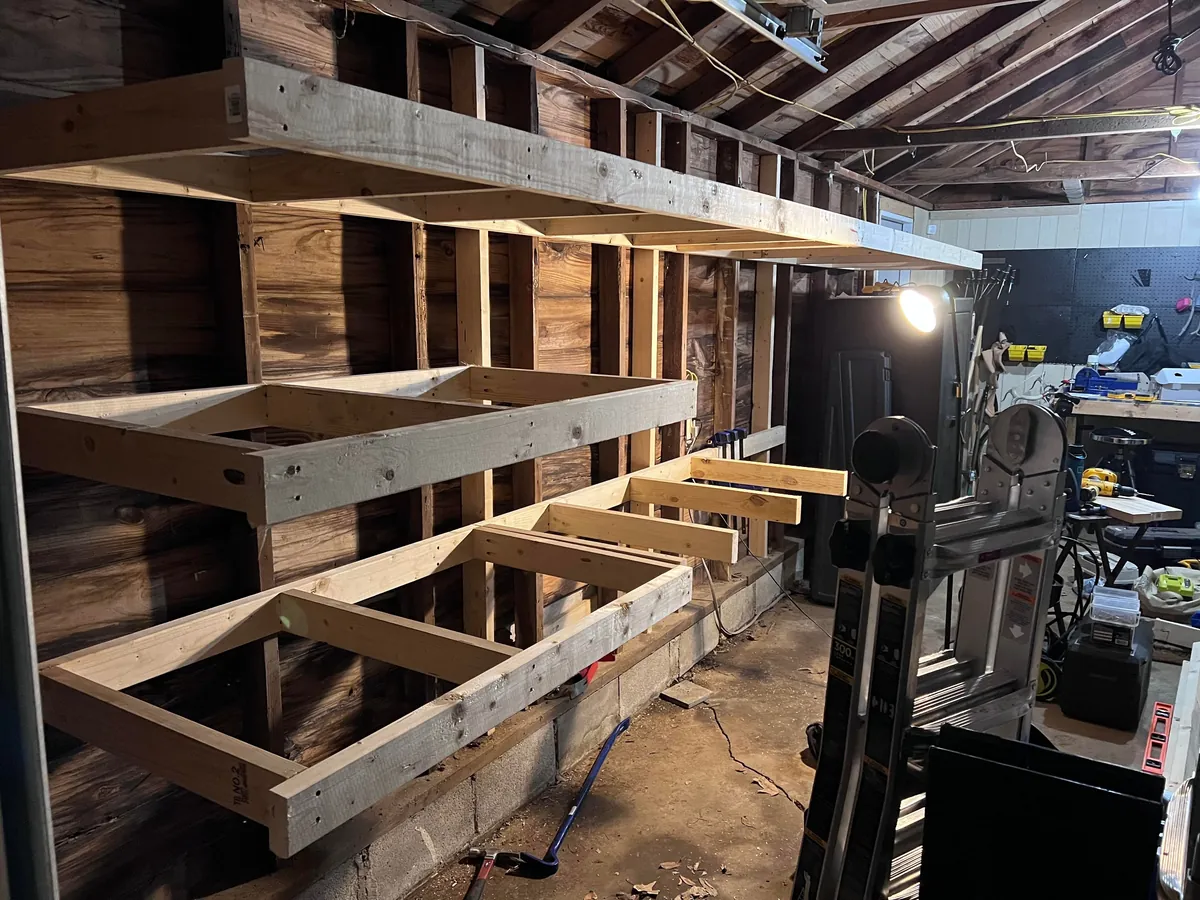 Completed a weekend project! Shelves and a workbench built into my garage.