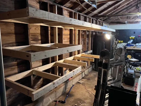 Completed a weekend project! Shelves and a workbench built into my garage.