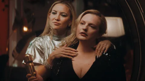 First Image of Kate Hudson &amp; Elisabeth Moss in body-horror 'SHELL' - Struggling actress Samantha tries Shell’s eternal youth treatment, dramatically improving her life and befriending CEO, Zoe. When former clients, including social media star Chloe Benson, go missing, Samantha fears for her safety