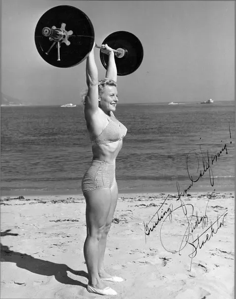 Abbye ‘Pudgy’ Stockton (physical culture promotor, writer, bodybuilder, strongwoman and athlete) 1917-2006. Lifting 135 at pounds at 115-20 herself, on Muscle beach california. possible 1940s. Pudgy was a nickname from childhoo. and yes the photo is signed by her.