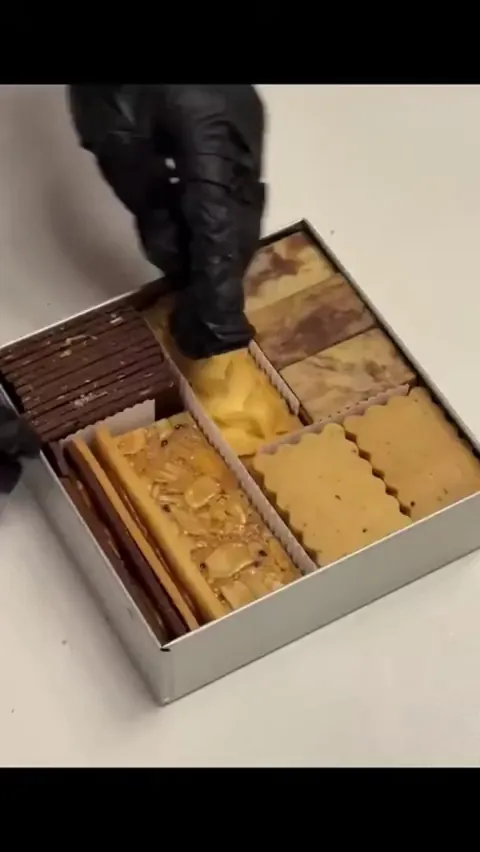 Fill a rectangular cookie tin with cookies.