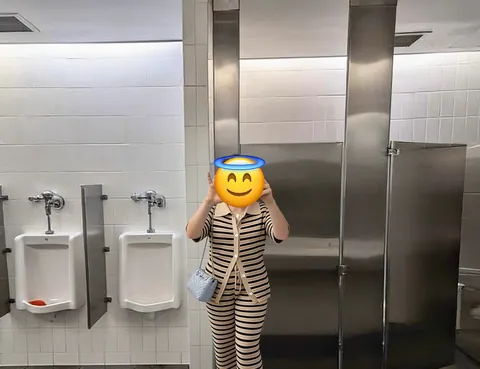 My boss dared me to go into the men’s bathroom at the restaurant we were at, strip fully naked and send him proof. I had to hide in the stall in between photos to avoid two men (and I’m so short I had to use a stool to even take the photo 😂). Dare complete!
