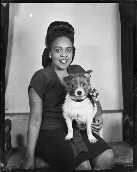 Young lady posing with her dear dog for a tummy shot, Safety Kodak, circa 1946.