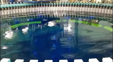 This video showcases Faraday waves, a fascinating phenomenon where a liquid's surface self organizes into intricate, repeating geometric patterns due to vertical vibrations