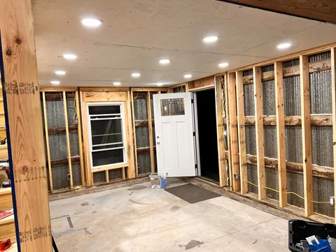 Progress from my 60+ yr old pole barn / workshop build