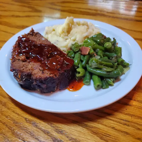 Smoked meatloaf with a bacon jam bbq sauce, green beans, and mashed taters.
