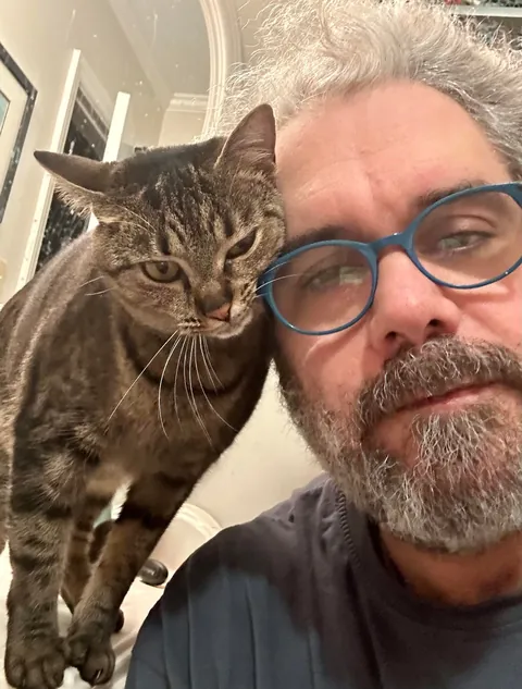 Day one on my hat and 14 months later. Enya still likes to be close.