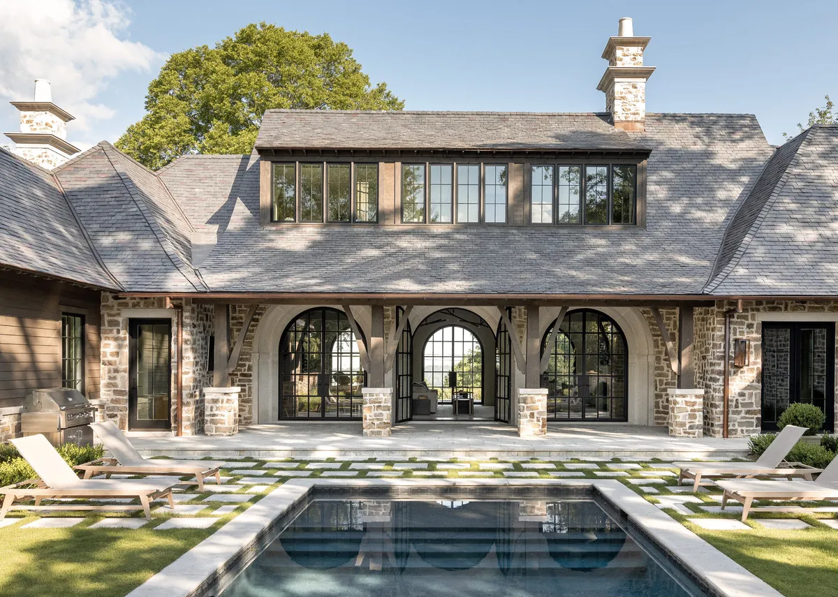 Living room with arched doors that open directly to the pool area in a Birmingham home, Alabama [2359×1680]