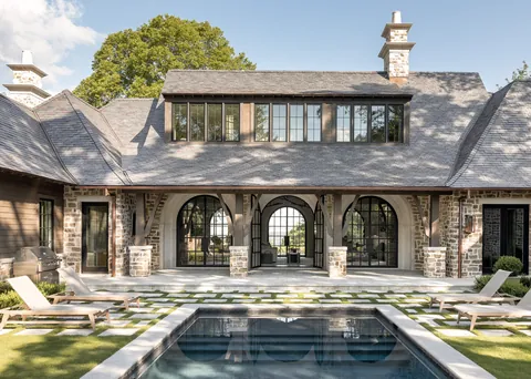 Living room with arched doors that open directly to the pool area in a Birmingham home, Alabama [2359×1680]