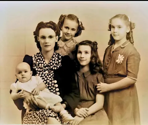 My grandmother and her 4 daughters in 1942. My grandfather was a POW of the Japanese when this photo was taken, and he had never met the baby, my mother, b. May 1941.