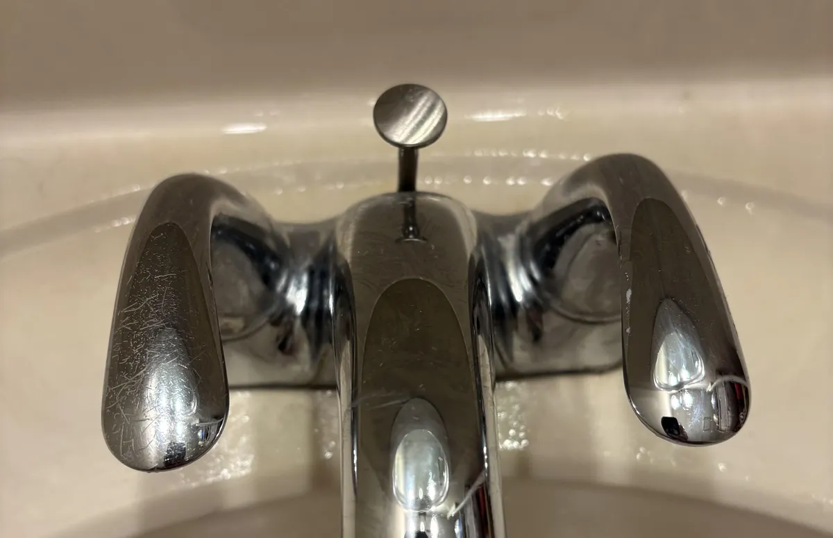 The faucet handle on the left is scratched by my wife’s wedding ring, but the handle on the right still looks almost new.