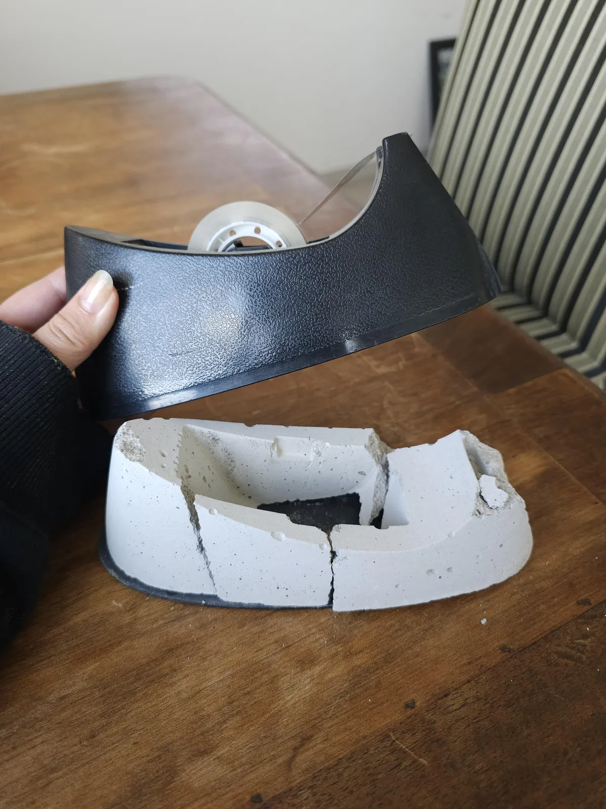 This tape dispenser has concrete inside of it