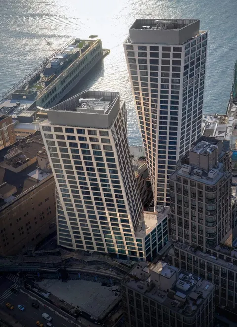 Danish architecture studio BIG has completed two residential skyscrapers with twisted forms alongside New York's High Line.