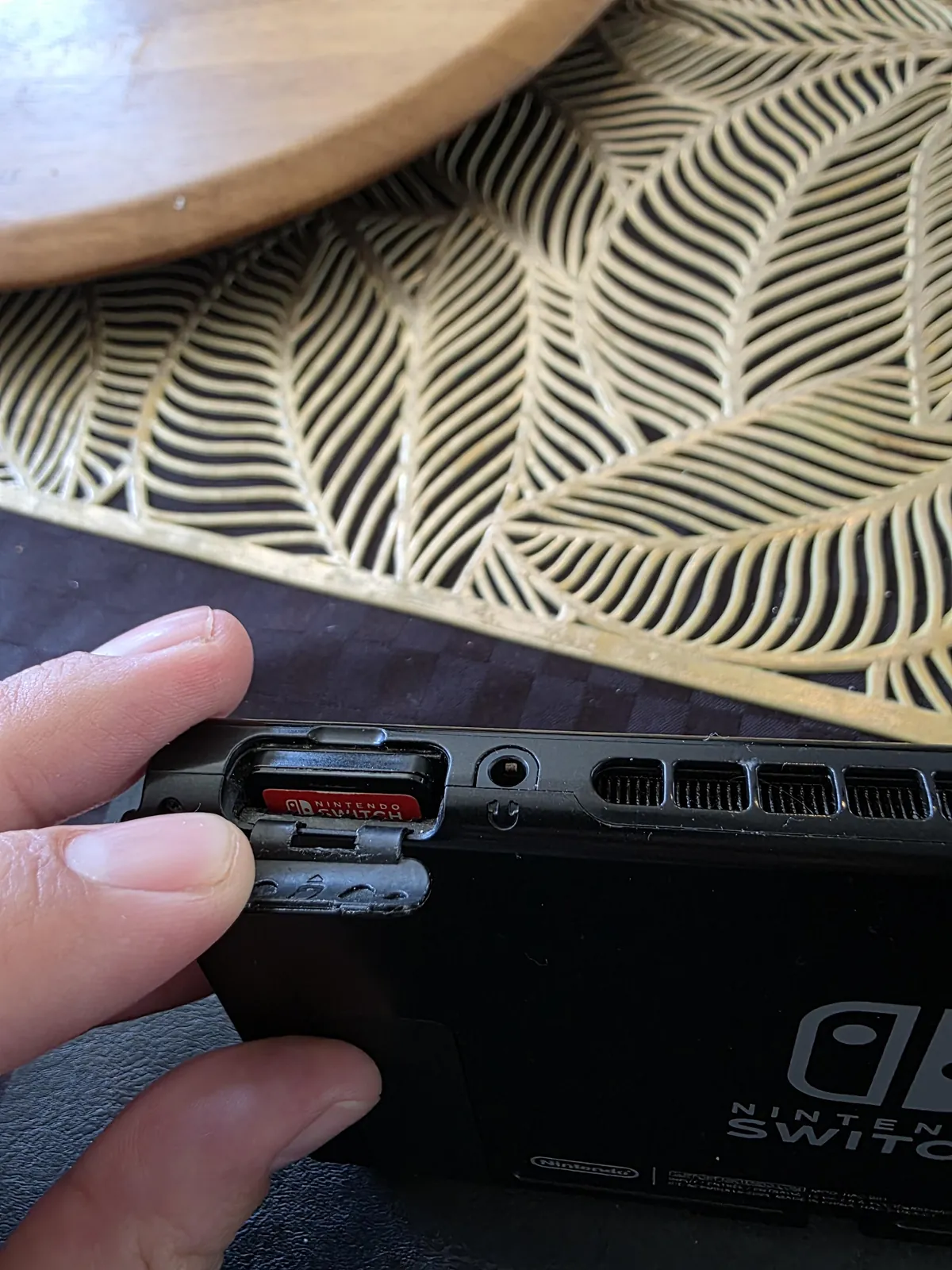 My daughter couldn't get the switch game in so forced it in... The wrong way