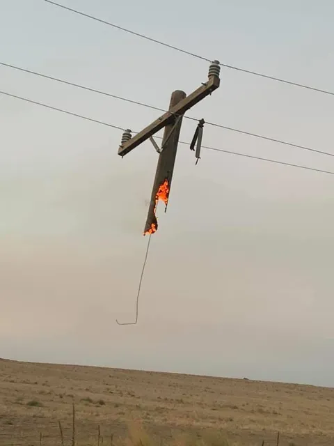 Partially burnt down electrical pole near my hometown