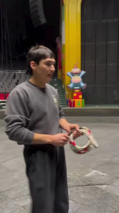 A guy jump-roping on top of a horse