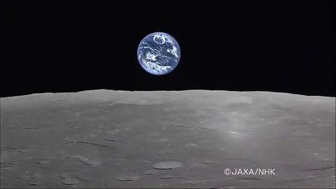 Real footage of Earth rising over the Moon captured by the Japanese lunar orbiter.