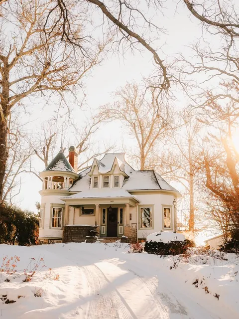 House with a turret in the snow, Cedar Rapids, Iowa.