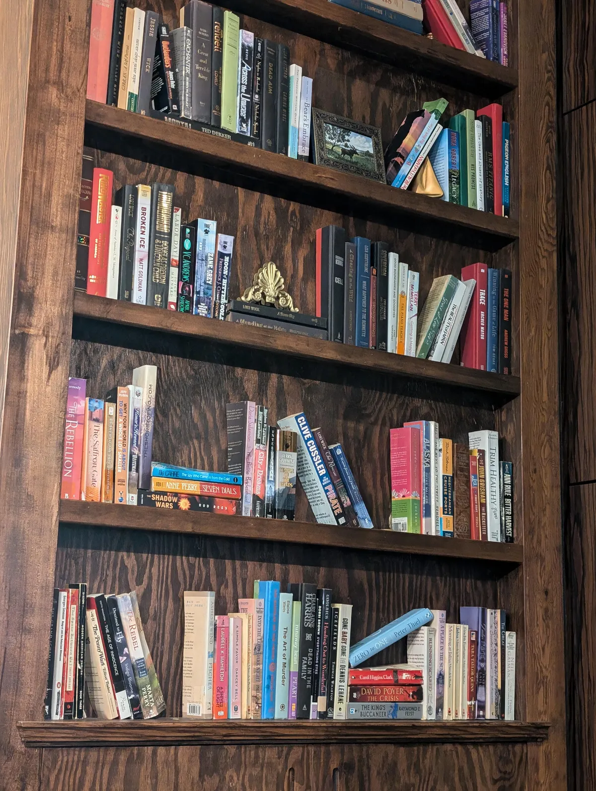 This restaurant cut their books in half to fit the shallow shelves