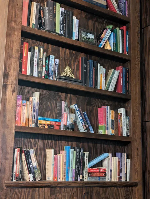 This restaurant cut their books in half to fit the shallow shelves