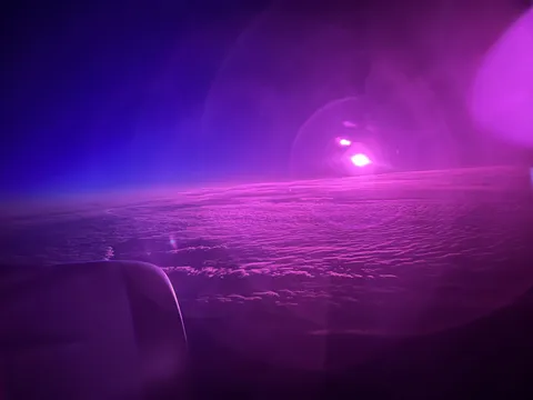 Flying over Greenland during sunrise