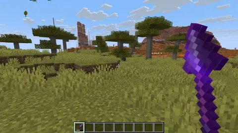 You can use the new Spear's Lunge enchantment to travel with an Elytra