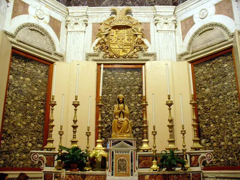 The bones of the 800 martyrs of Otranto surrounding the statue of Virgin Mary.