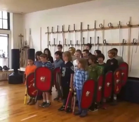 Kids demonstrating the effectiveness of the Roman Testudo formation 