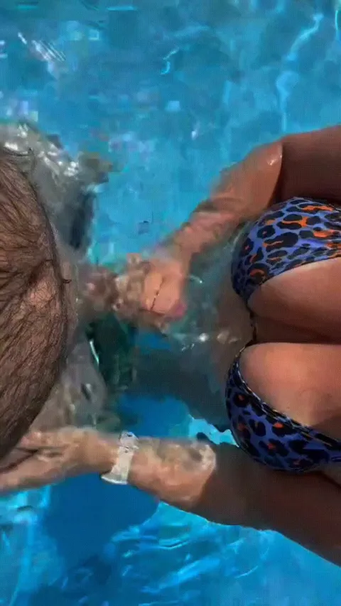 I made hubby stand outside of the pool while I stroked his friends thick hard cock until he shot a massive load between my 38DD juggs… Later he bent me over the pool stairs…