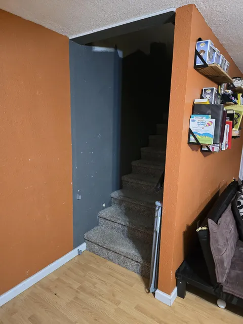 My wife wants me to put a door at the bottom of these stairs. What are the rules about doing this