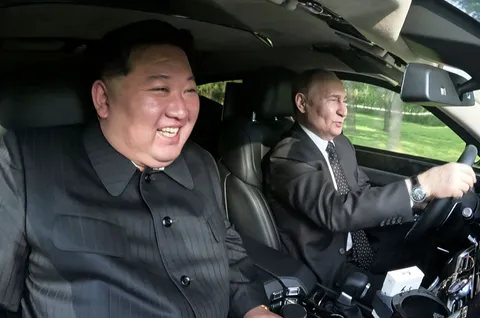 President Putin taking the driver's seat of the car he presented to Comrade Kim Jong Un as a gift