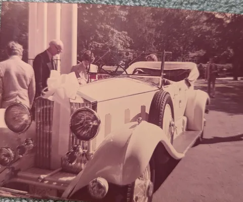 My parents leave their wedding in style in a vintage Rolls Royce.  1975.