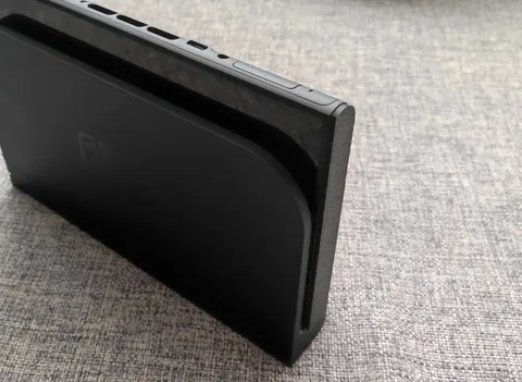 I made a simple, 3d printable side dust cover and protector for the Switch 2