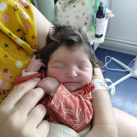 I was not aware newborn babies could have this much hair. She looks like a manga character.