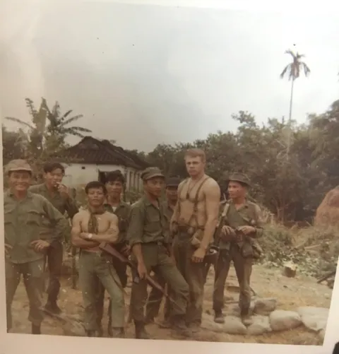My grandfather in Vietnam (the tall caucasian man)