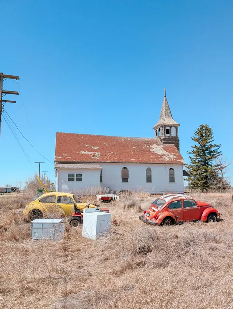 Abandoned cars and church
