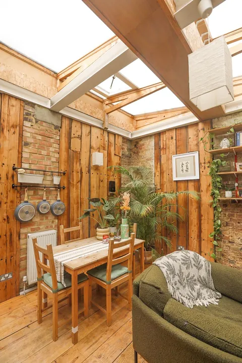 My cozy garden flat in London, featuring my fuzzy friend who slept on the roof