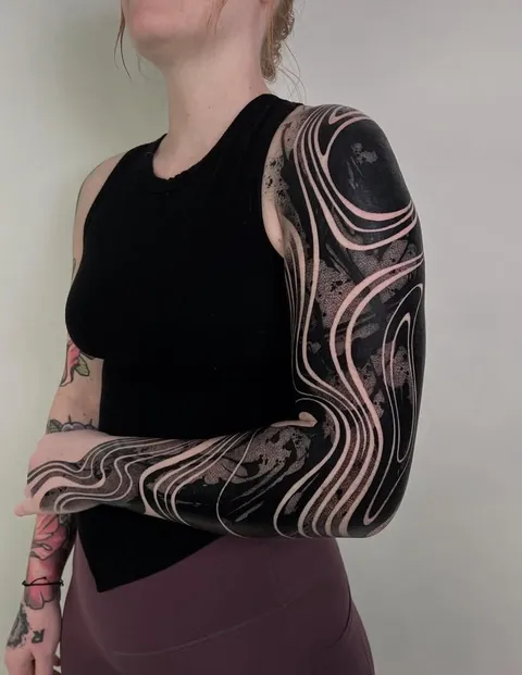 Blackwork coverup sleeve tattoo done by @___p_e_s_t_e___ at All Sacred Tattoo in Denver